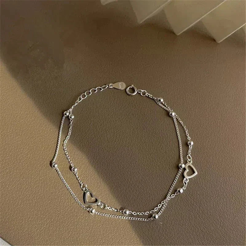 Verstellbares Herzarmband aus Silber
